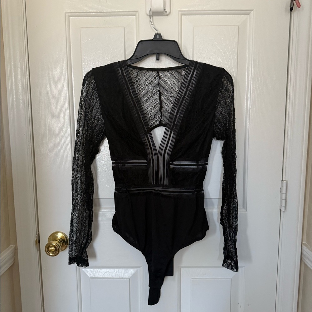 Lulu's Black Long Sleeve Asymmetrical Cut Out Top